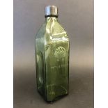 A French Shell green glass bottle with a Shell motif to both sides.