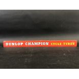A Dunlop Champion Cycle Tyres shelf strip.