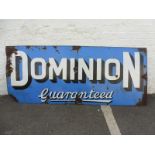 A Dominion Guaranteed rectangular enamel sign, 71 3/4 x30".