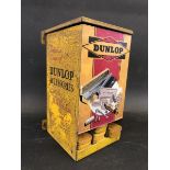 A Dunlop Accessories repair kit dispensing cabinet with four tins inside, 5 1/2" wide x 9" high x