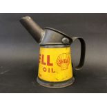 A Shell Motor Oil half pint oil measure in excellent condition, dated 1949.