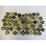 A collection of approximately 60 oil bottle caps.