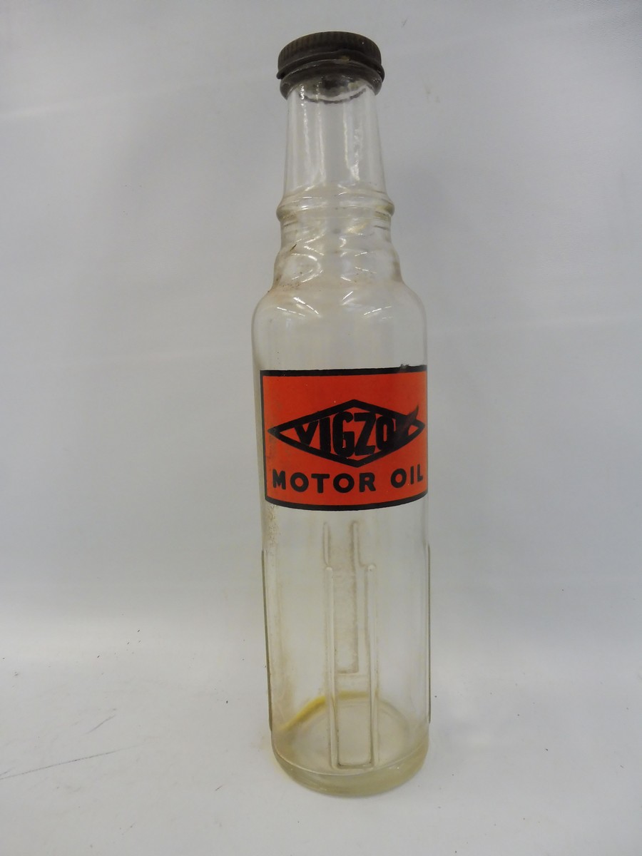 A Vigzol glass oil bottle.