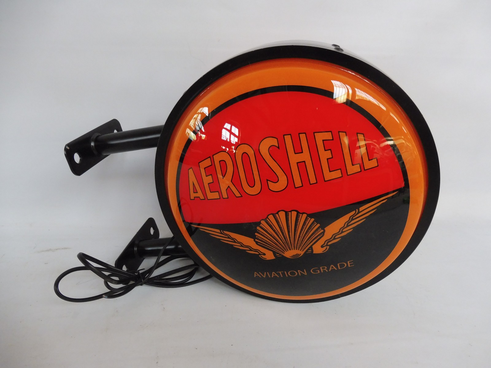 A contemporary plastic illuminated lightbox advertising 'Aeroshell Aviation Grade', 15" wide x 12"