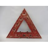 A triangular warning sign inset with red reflective discs, 18 x 15 3/4".