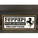 A decorative and contemporary lightbox with perspex panels advertising Ferrari Sales and Service