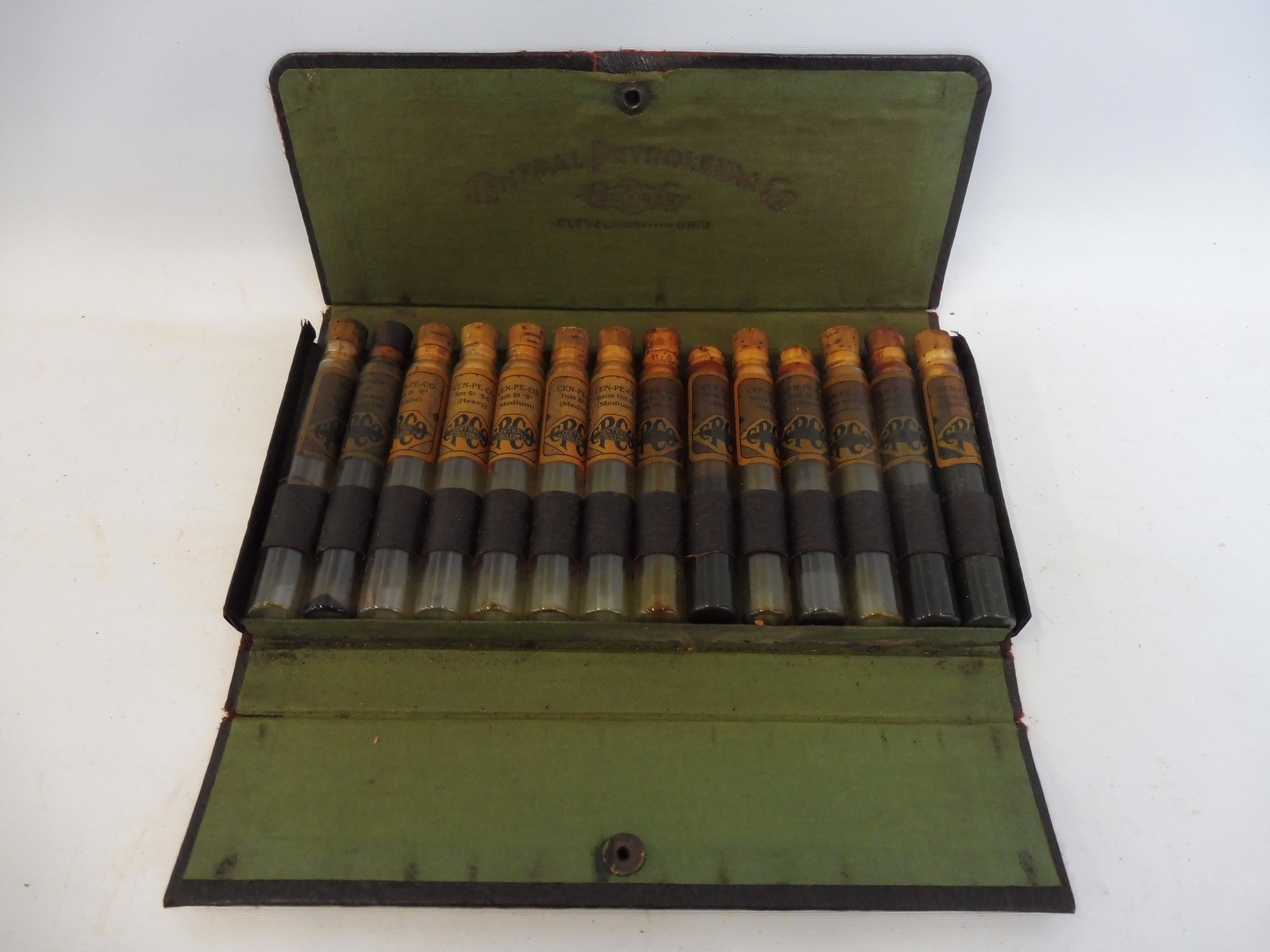 A very early Central Petroleum Company salesman's sample set of 14 viles with original labels, in