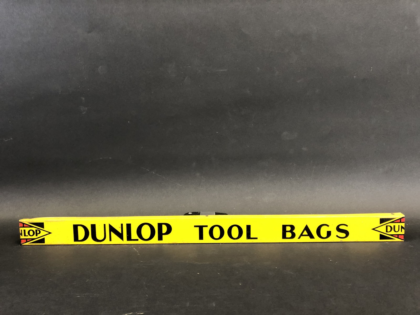 A Dunlop Tool Bags shelf strip in good condition.