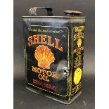 A Shell Motor Oil half gallon rectangular can.