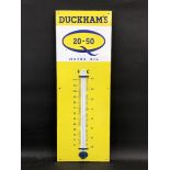 A Duckham's 20-50 Motor Oil enamel thermometer, in very good condition, 12 x 36".