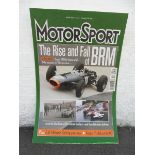 A large showroom display board depicting the front cover of MotorSport magazine, April 2001 'The