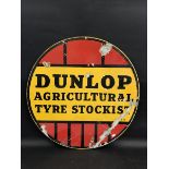 A Dunlop Agricultural Tyre Stockist circular double sided enamel sign, 24" diameter.