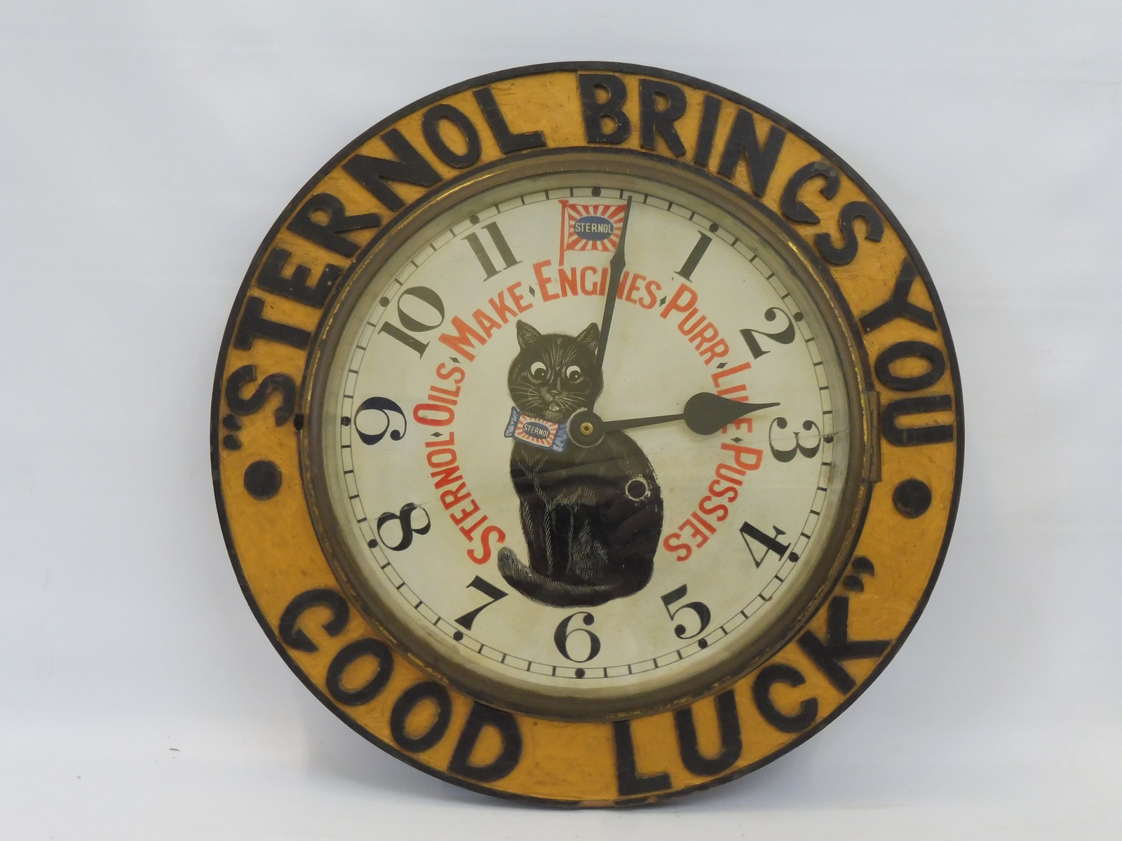 A rare Sternol Oils circular wooden advertising wall clock, with original painted dial depicting