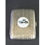 A Morris Commercial Cars silver plated cigarette case, the lid inset with a circular porcelain or