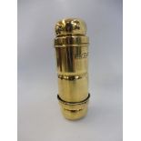 A brass Joseph Lucas spare bulb holder no. 170.