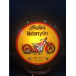 A contemporary decorative plastic globe advertising Indian Motorcycles.