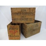 Three wooden packing crates, including Plume.