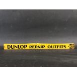 A Dunlop Repair Outfits shelf strip, one end reduced slightly.