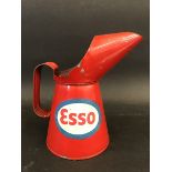 A pint oil measure with Esso labels to either side.