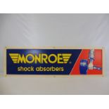 A Monroe shock absorbers embossed plastic sign, 51 x 15 1/2".