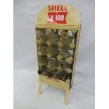 A 12 division oil bottle trolly containing a full set of bottles, restored in Shell livery.