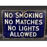 A 'No Smoking, No Matches, No Lights Allowed' rectangular garage forecourt enamel sign unusually