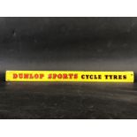 A Dunlop Sports Cycle Tyres shelf strip.