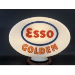 An Esso Golden glass petrol pump globe of excellent bright colour by Hailware, one minor nick to