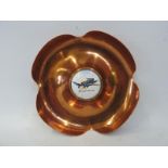 A Blue Bird Petrol copper advertising ashtray with enamel disc inset to the centre.