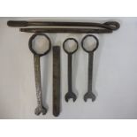 Three early ring spanners plus three early Dunlop tyre levers.