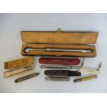 A cased Schrader Service Tyre Gauge plus a tray of other gauges and collectables including a