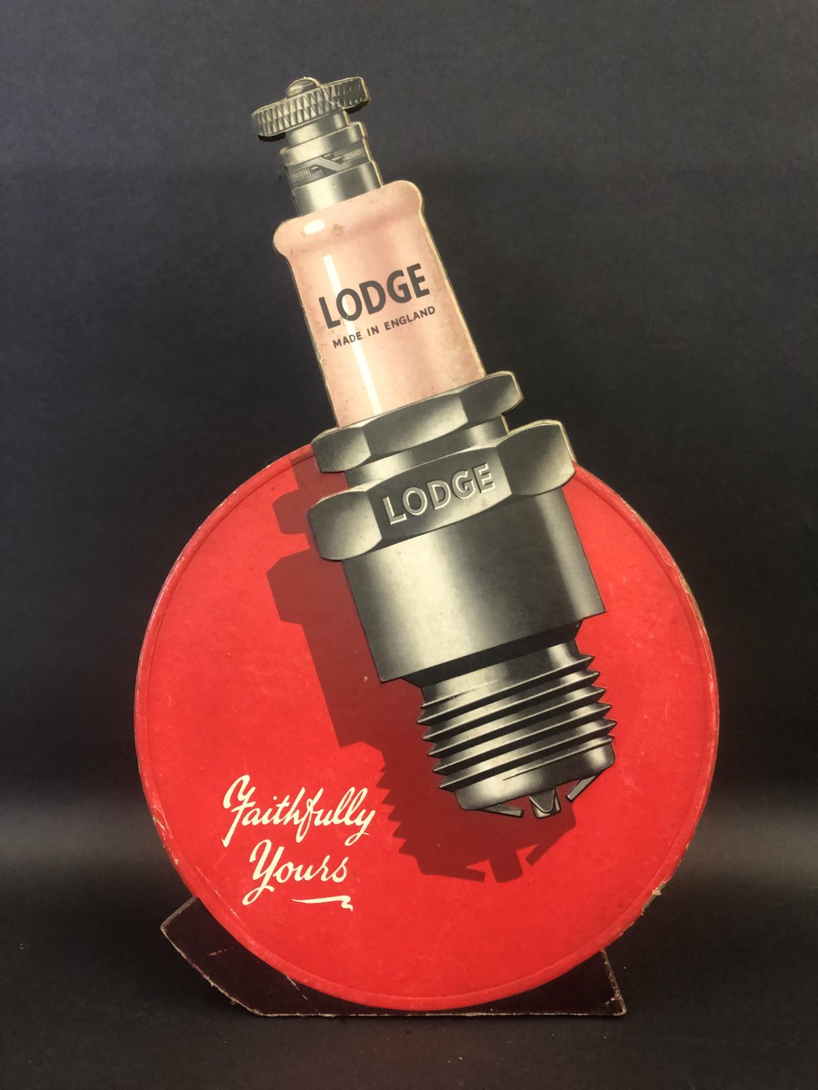 A Lodge spark plugs die-cut showcard, 9 3/4" w x 15 3/4" h.