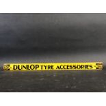 A Dunlop Tyre Accessories shelf strip in good condition.