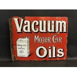 A Vacuum Motor Car Oils part pictorial double sided enamel sign with hanging flange by Protector, 20