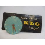 A K.L.G. Plugs wall mounted advertising clock, 18 x 9 3/4".