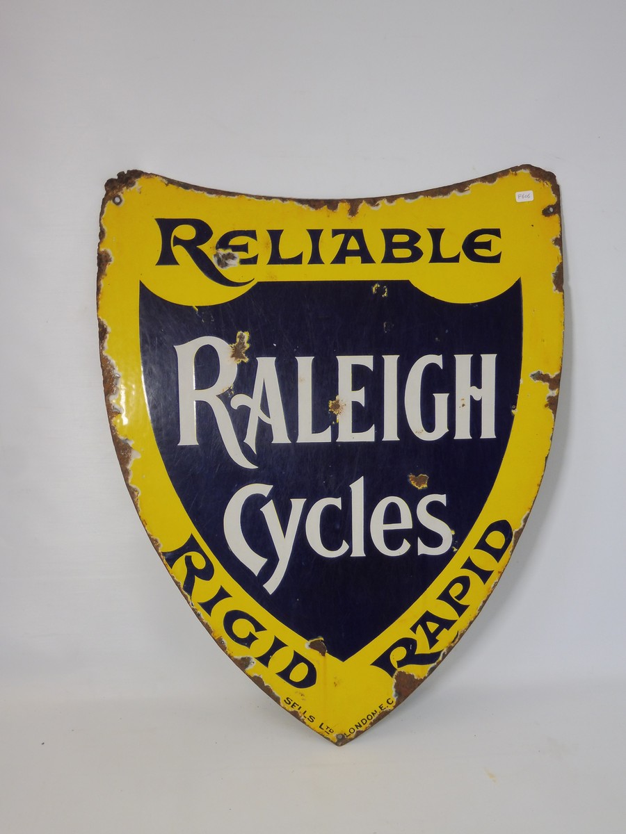 A Raleigh Cycles shield shaped double sided enamel sign by Sells Ltd London E.C. 18 1/4 x 24".