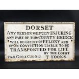 A rare and early cast iron Dorset road sign with great wording regarding 'injuring any part of