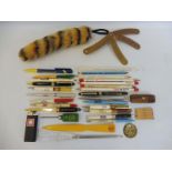 A tray of promotional pens and pencils and various other marketing items including Shell, Esso,