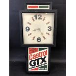 A Castrol GTX wall clock, 11 3/4" wide x 24" high x 4 1/2" deep.