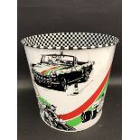 A Castrol Motor Racing design waste paper bin featuring the Mini Cooper and Ford Escort rallying,