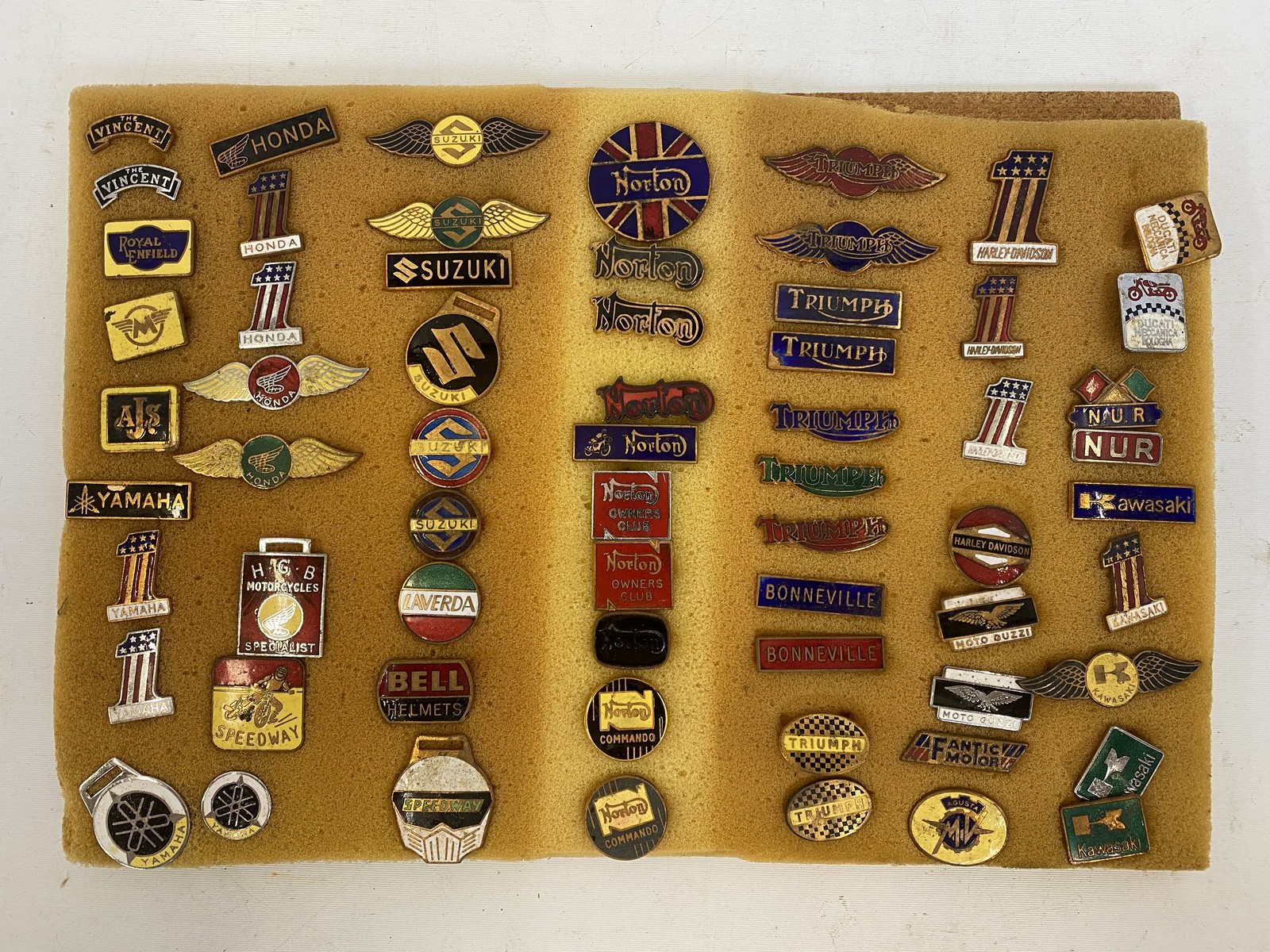 A collection of motorcycle enamel manufacturers/club badges, circa 1950s-1980s, including Vincent,
