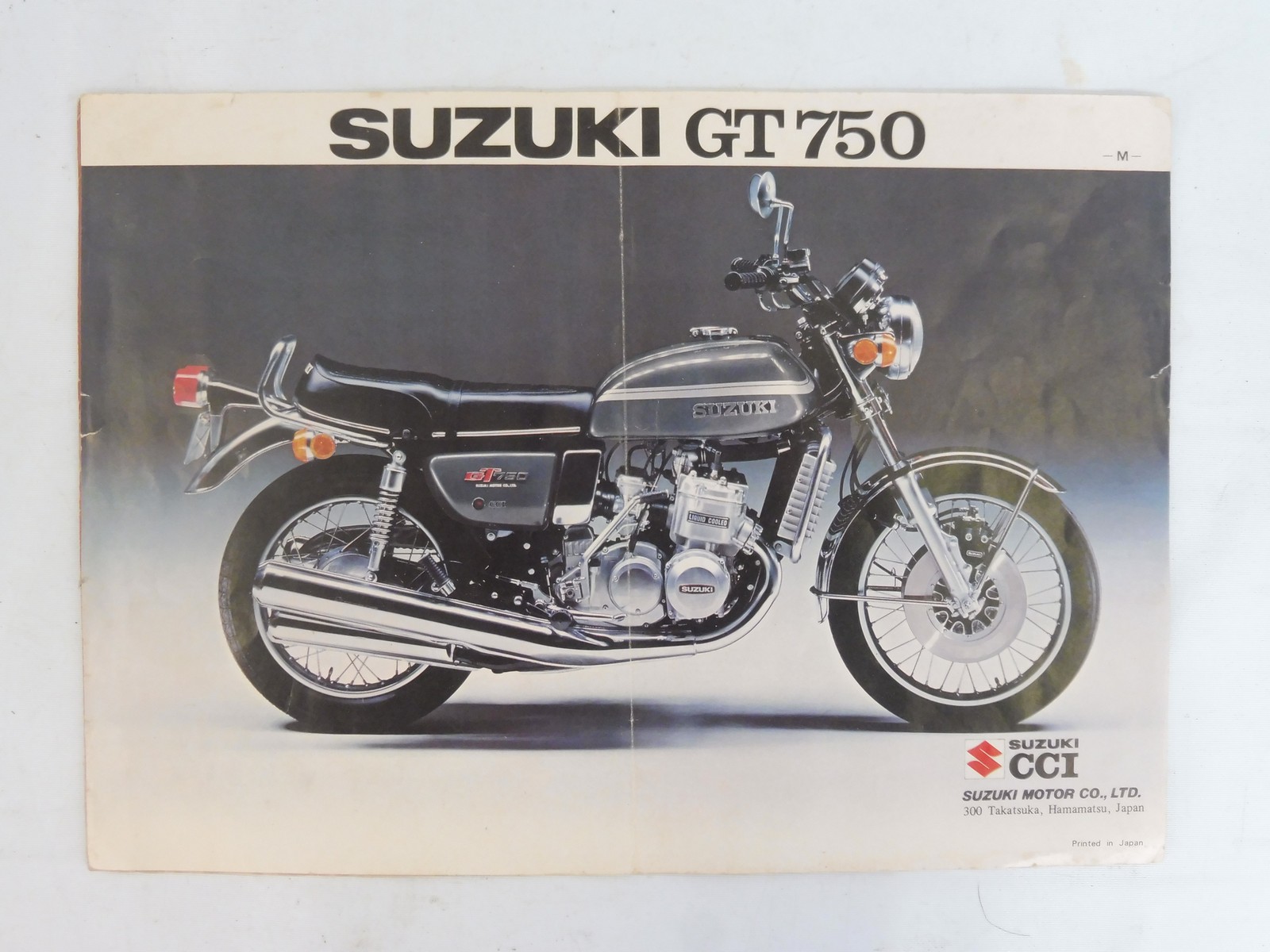 Two Suzuki GT750 advertising leaflets.