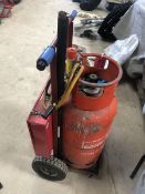 A gas bottle trolley with professional gas torch kit plus brass rods etc.