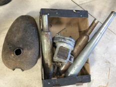 A vintage BSA gearbox, an unknown petrol tank and three silencers.