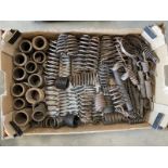 A large tray of springs for vintage motorcycle girder forks and seat frames.