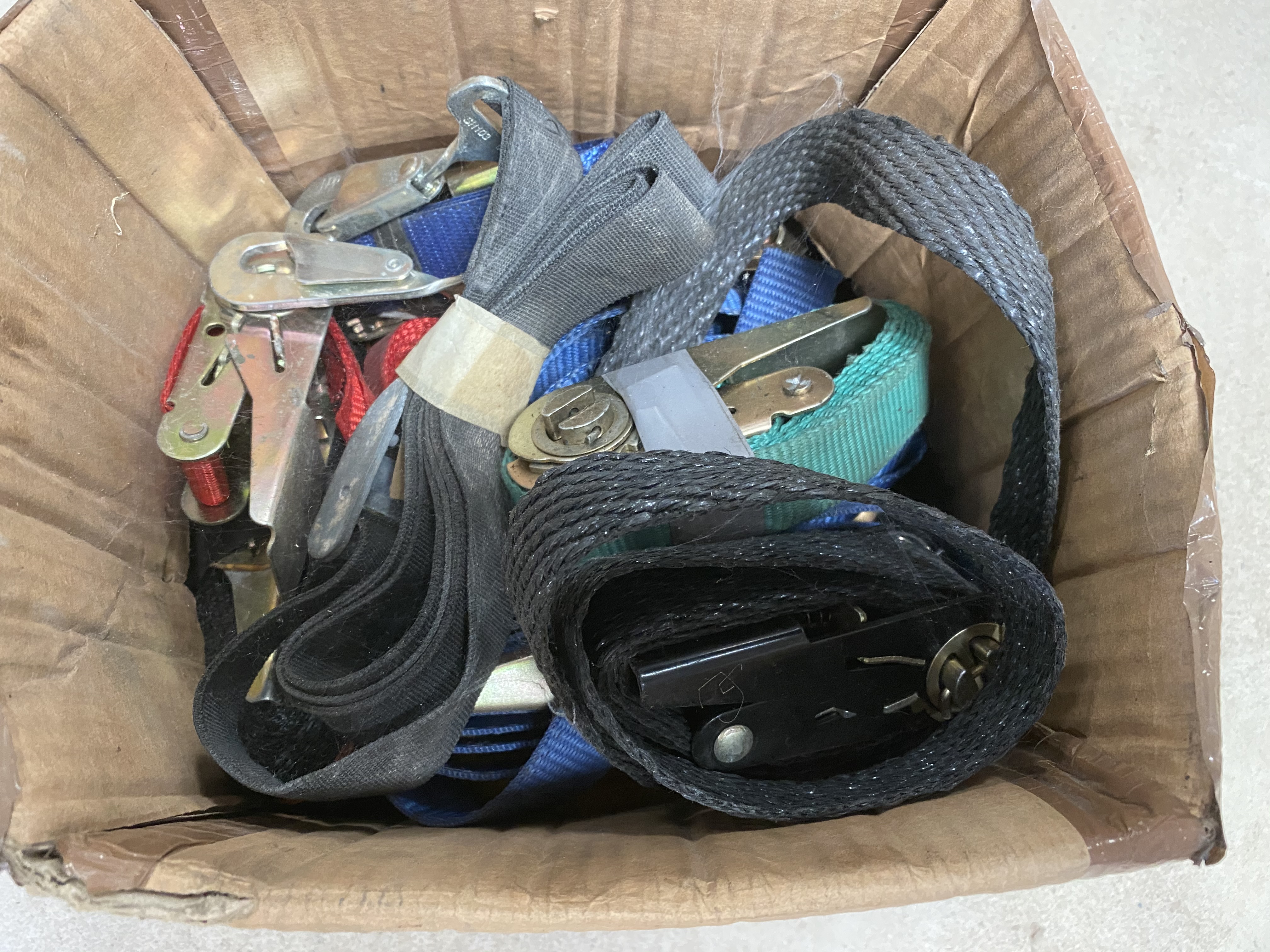 A small box of motorcycle straps.