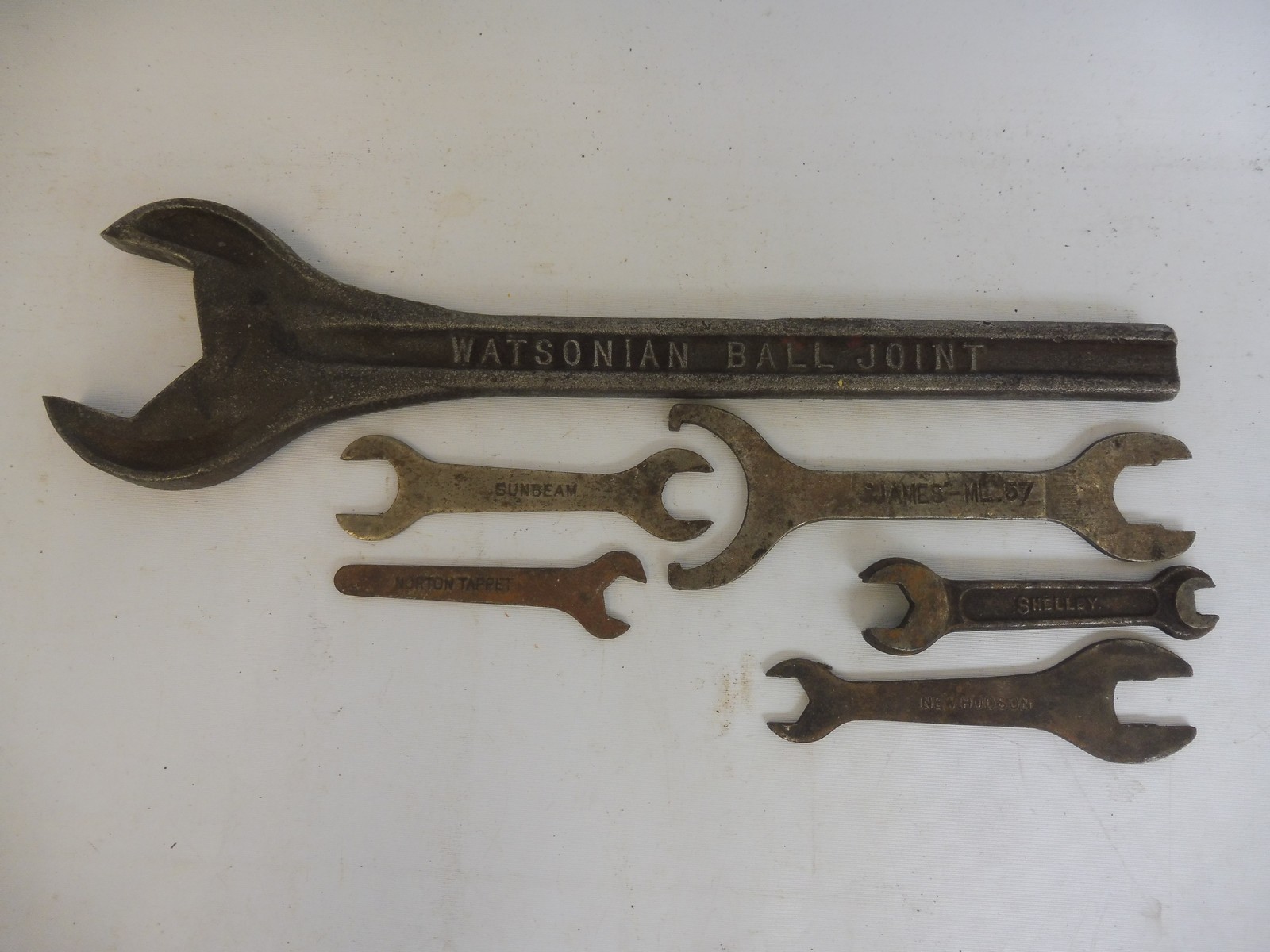 A small group of motorcycle spanners including New Hudson, Enfield etc. plus a large 'Watsonian Ball