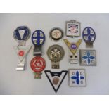 A selection of car badges to include Disabled Drivers Motor Club.