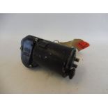 A CAV 6 volt wiper motor, new old stock, still with labels attached.