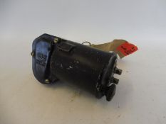 A CAV 6 volt wiper motor, new old stock, still with labels attached.
